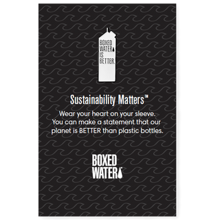 white pin in shape of carton on a black card