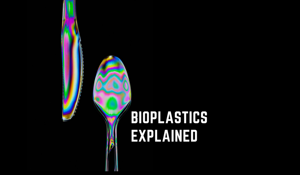 Plastic fork and knife on black background with text overlaid reading "bioplastics explained" 