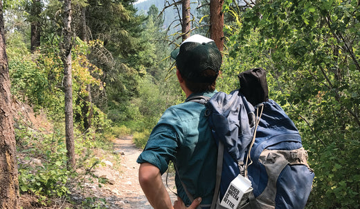 Man hiking in a wooded path