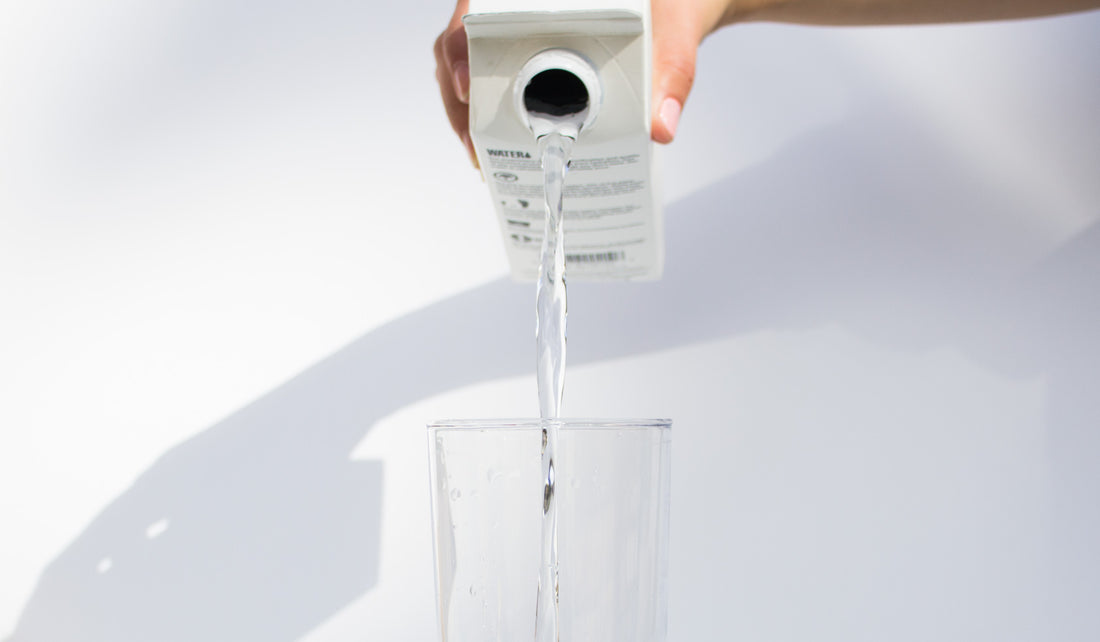 Boxed Water pouring into a glass 