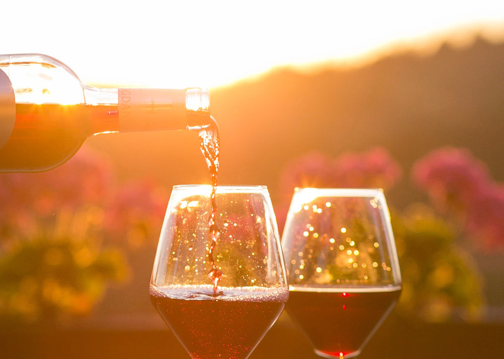 Two glasses of wine at sunset