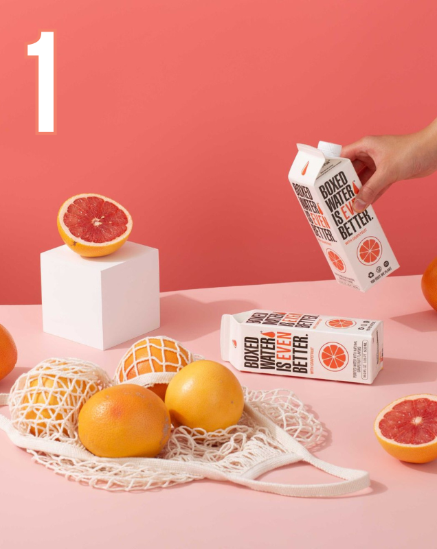 Number 1 with Grapefruits and grapefruit-flavored Boxed Water on a pink background