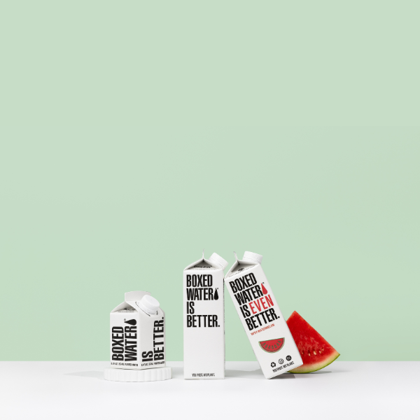 green background with boxed water cartons and watermelon slice